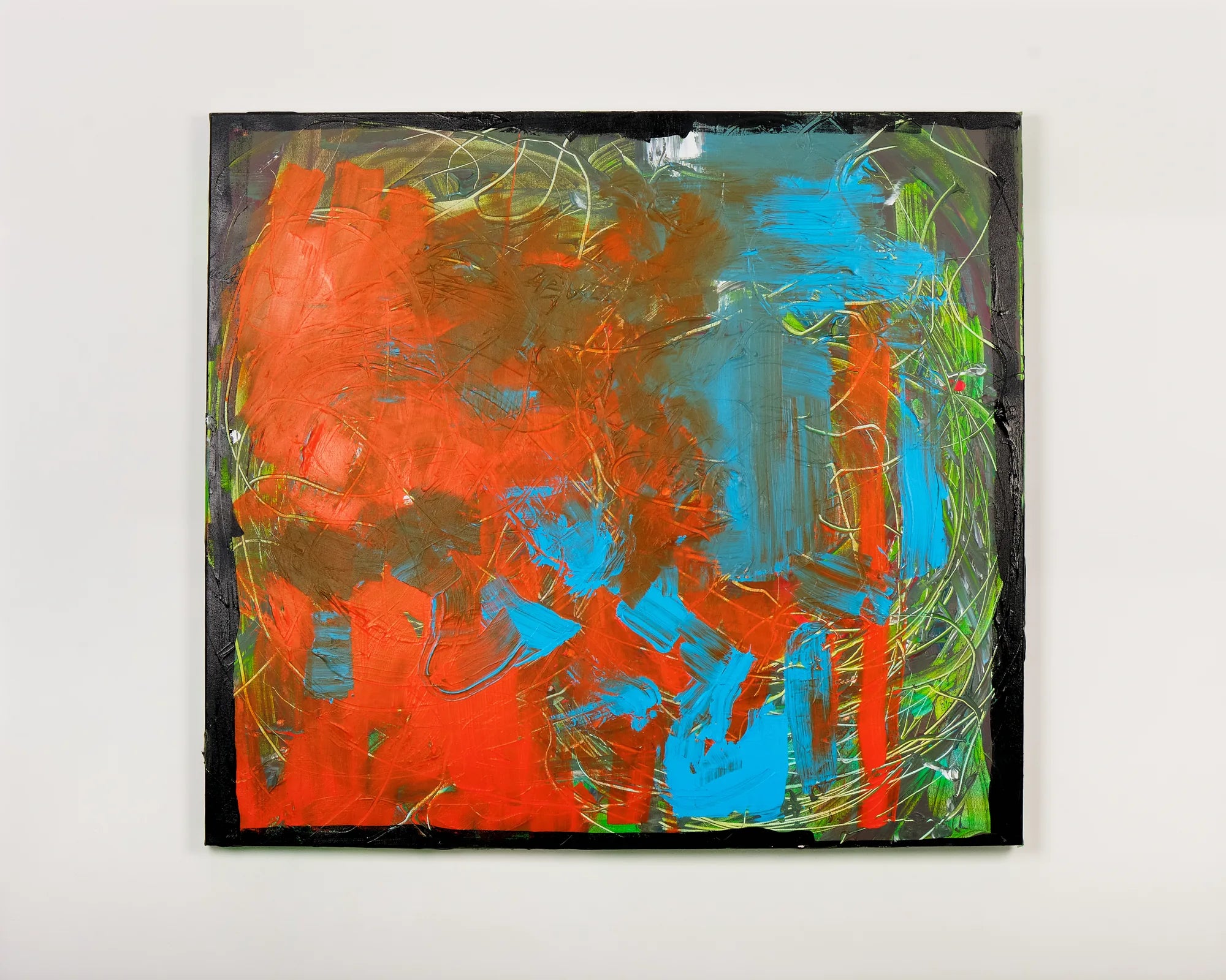 Orange and turquoise abstract painting photographed in the studio